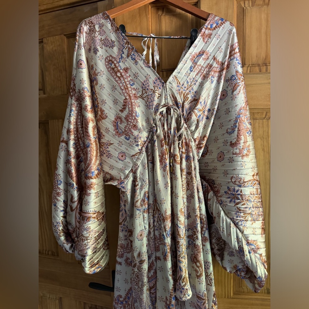 Free people flowy mini dress with bell sleeves and tie back